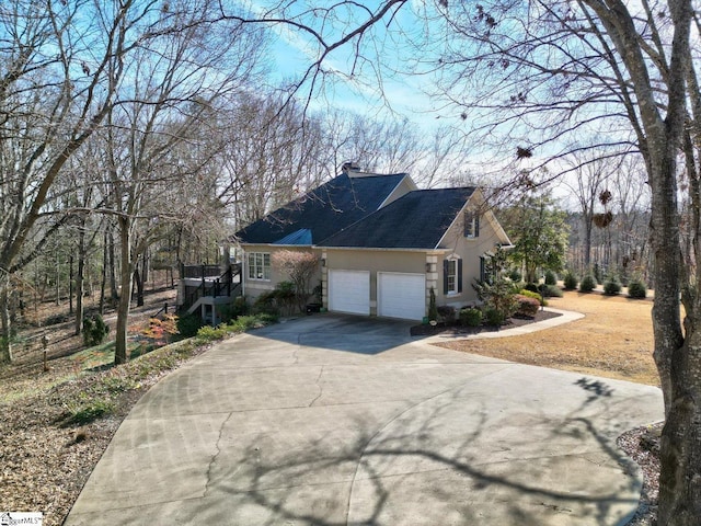 view of property exterior featuring a garage