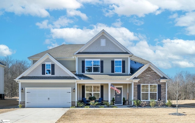 craftsman inspired home with central air condition unit, covered porch, and a garage