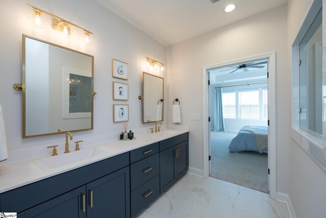 bathroom with ceiling fan and vanity