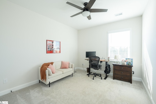 carpeted office with ceiling fan