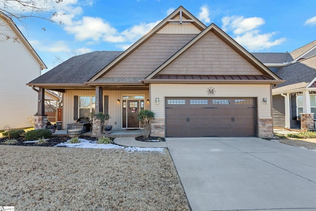 craftsman-style home featuring a garage and a porch