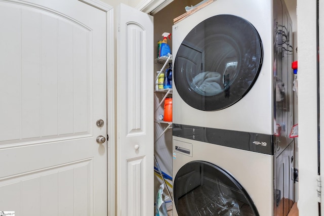 laundry room featuring stacked washer / dryer