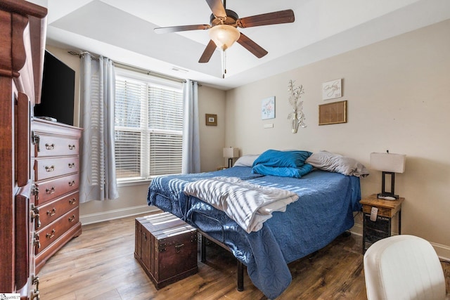 bedroom with ceiling fan and light hardwood / wood-style flooring