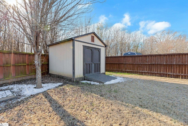 view of outbuilding featuring a lawn