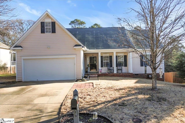 view of front of property with a garage and a porch