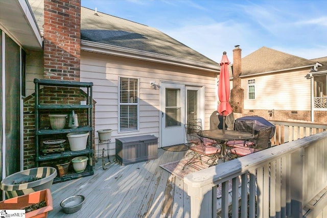 wooden terrace with area for grilling