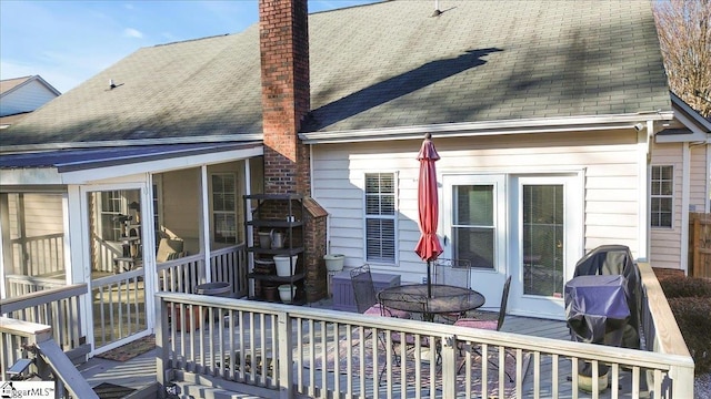 back of house featuring a wooden deck