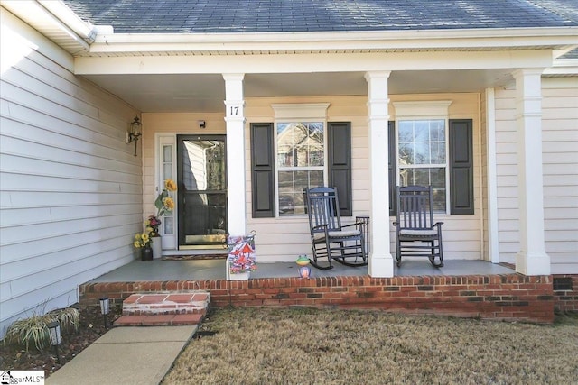 property entrance with covered porch