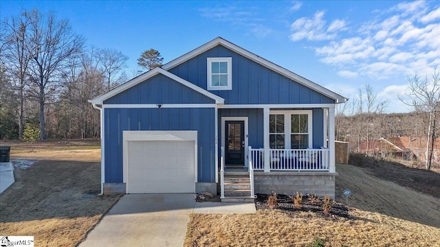 view of front of home featuring a garage and covered porch