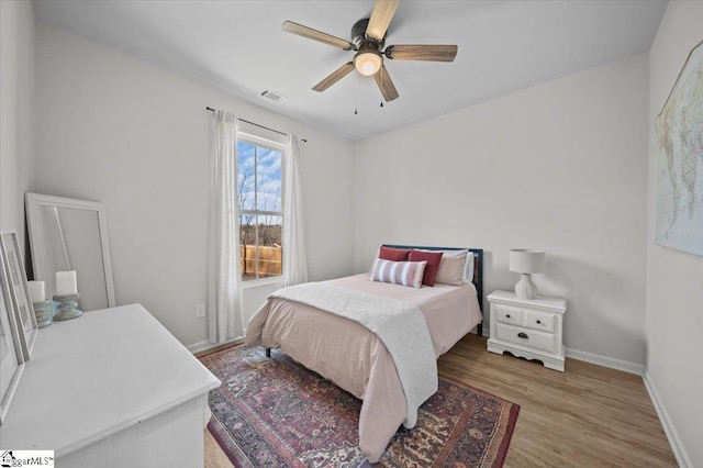 bedroom featuring ceiling fan and wood-type flooring