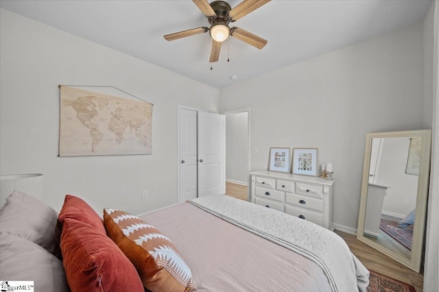 bedroom with ceiling fan and wood-type flooring