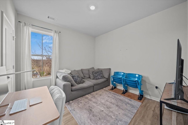 living room featuring light wood-type flooring