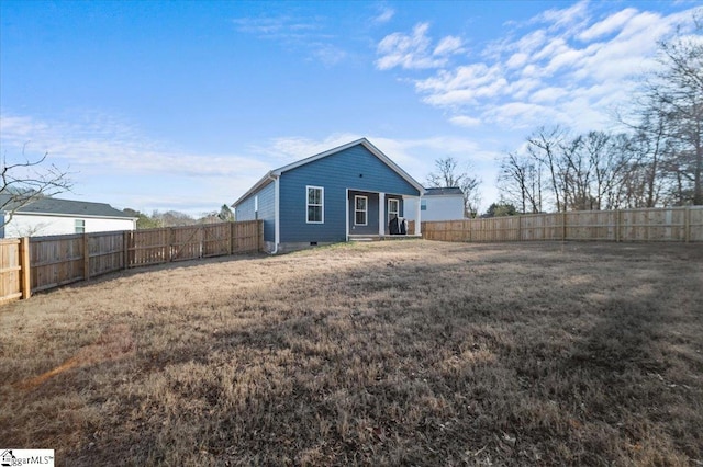 back of house with a yard