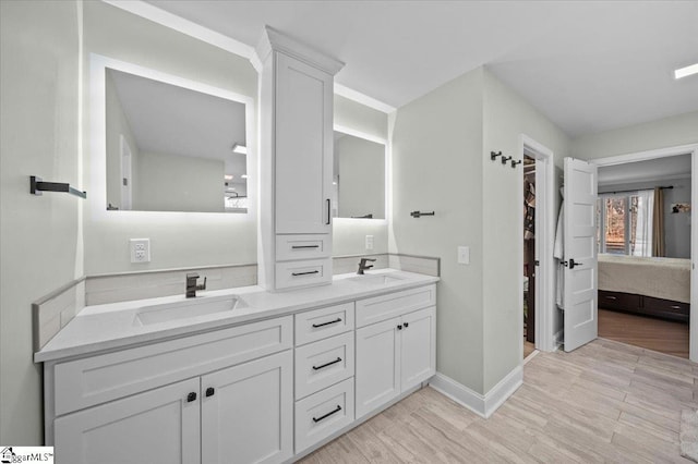 bathroom featuring hardwood / wood-style floors and vanity