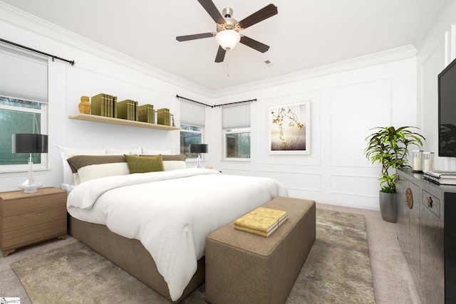 bedroom featuring ceiling fan, carpet, and ornamental molding