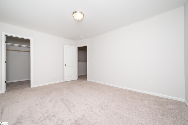 unfurnished bedroom featuring a closet and carpet flooring