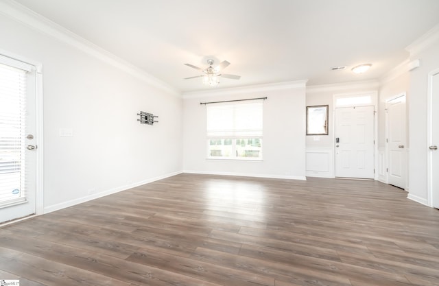 unfurnished living room featuring ceiling fan, crown molding, and dark hardwood / wood-style floors