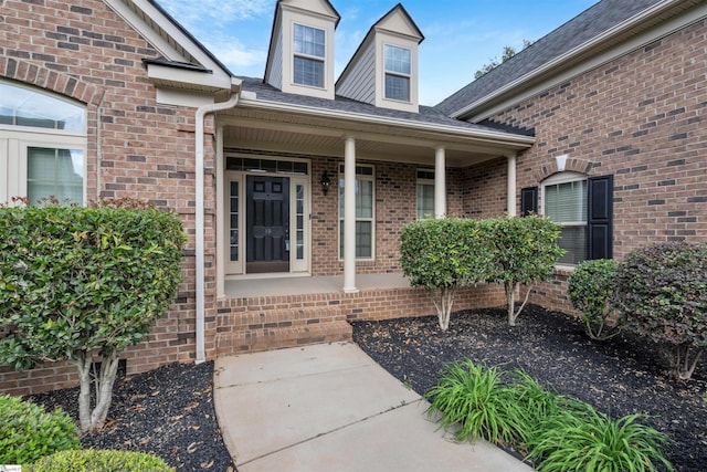 property entrance featuring covered porch