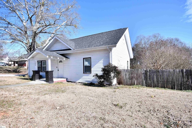 view of front facade featuring a front yard and a patio area