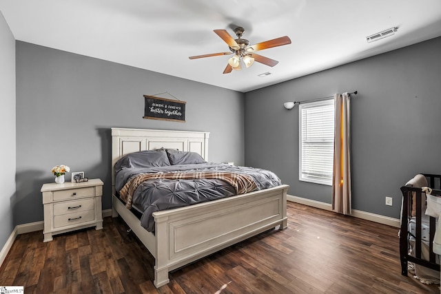 bedroom with ceiling fan and dark hardwood / wood-style flooring