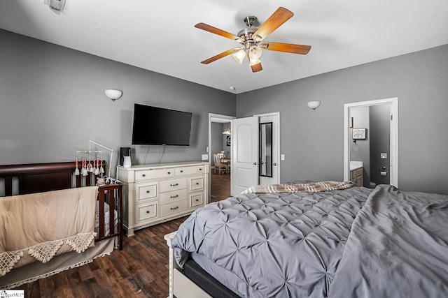 bedroom with ceiling fan, dark hardwood / wood-style flooring, and connected bathroom