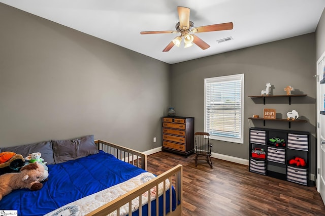 bedroom featuring ceiling fan and dark hardwood / wood-style floors