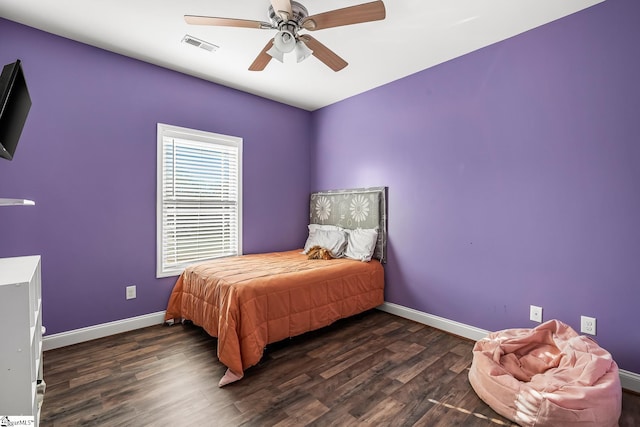 bedroom featuring ceiling fan and dark hardwood / wood-style floors