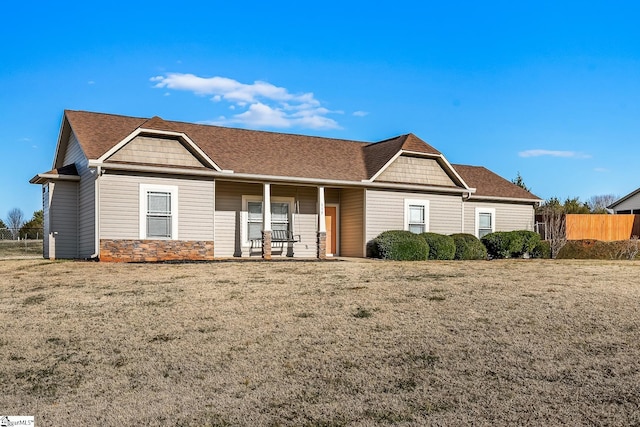 view of front of home with a front lawn and covered porch