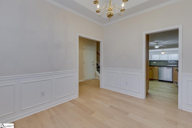 unfurnished room with ornamental molding, ceiling fan with notable chandelier, and light hardwood / wood-style flooring