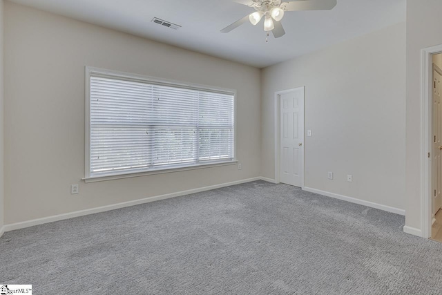 unfurnished room featuring ceiling fan and light colored carpet