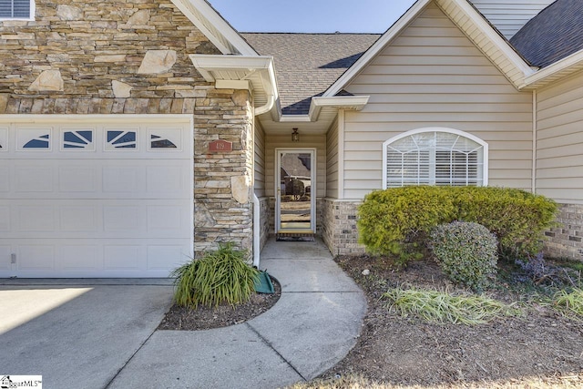 view of exterior entry featuring a garage