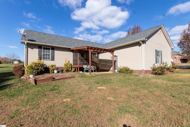 rear view of property with a yard and a patio