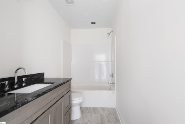 full bathroom with shower / tub combination, toilet, and vanity