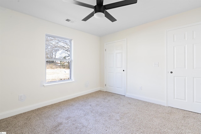 unfurnished bedroom featuring ceiling fan and carpet flooring