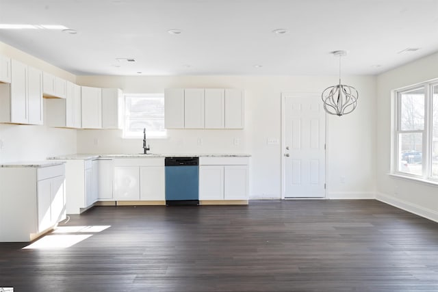 kitchen featuring dishwasher, decorative light fixtures, white cabinetry, sink, and a chandelier