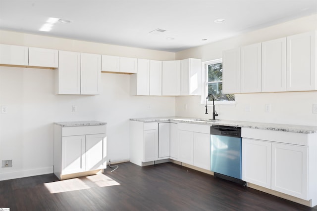 kitchen featuring dark wood-type flooring, white cabinets, dishwasher, and sink