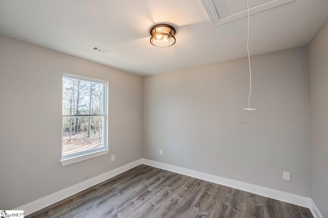 empty room with hardwood / wood-style flooring