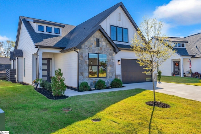 view of front of house featuring a front lawn and a garage