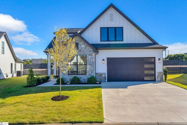 view of front of house featuring a front lawn and central AC unit