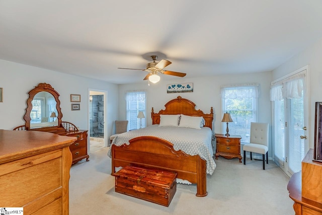 carpeted bedroom featuring ceiling fan and connected bathroom