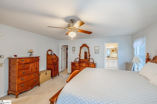 carpeted bedroom featuring ceiling fan, ensuite bathroom, a closet, and a spacious closet