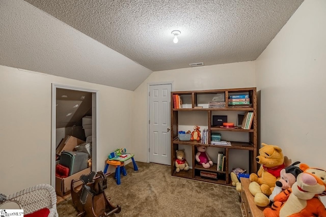 game room featuring carpet floors, a textured ceiling, and vaulted ceiling