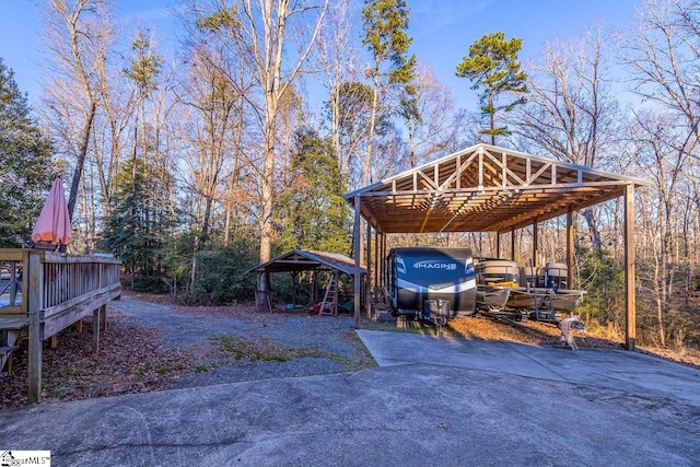 view of vehicle parking with a carport