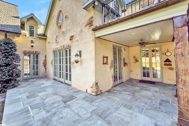 view of patio with ceiling fan and french doors