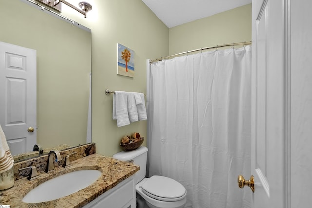 bathroom with toilet and vanity