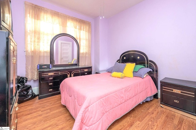 bedroom with light wood-type flooring