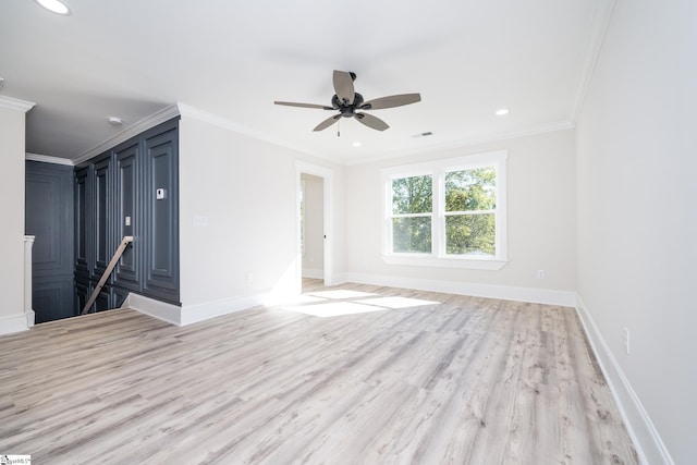 unfurnished room with recessed lighting, crown molding, light wood-style flooring, and baseboards