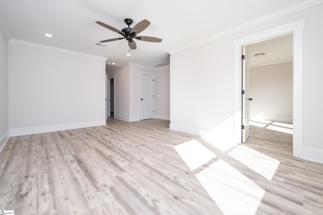 empty room featuring light wood-style floors, crown molding, baseboards, and a ceiling fan