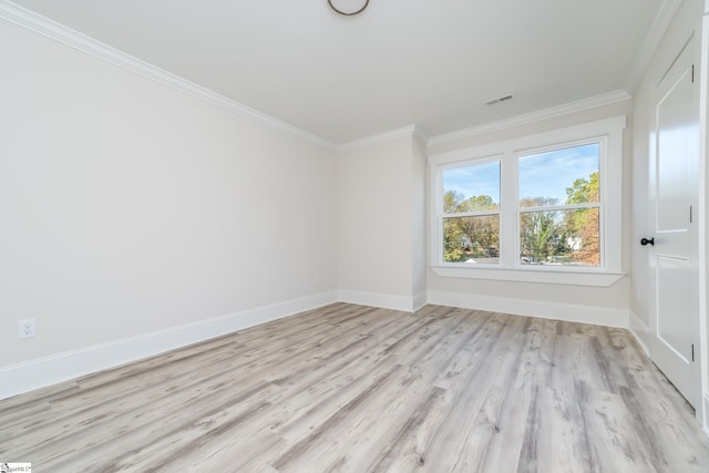 empty room with light wood-style floors, baseboards, visible vents, and ornamental molding