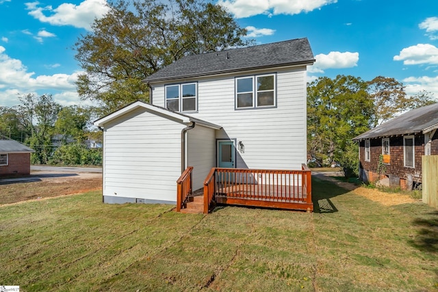 rear view of house featuring crawl space, a lawn, and a wooden deck